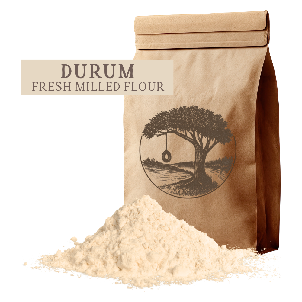 A bag of golden fresh-milled Durum flour by Kern River Milling. High-protein healthy grains for pasta and organic whole wheat bread. Quality whole grain products shipped throughout the United States.
